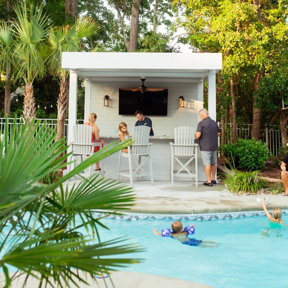 family time outside with kids in the pool and adults under the pergola bar. Wilmington, NC